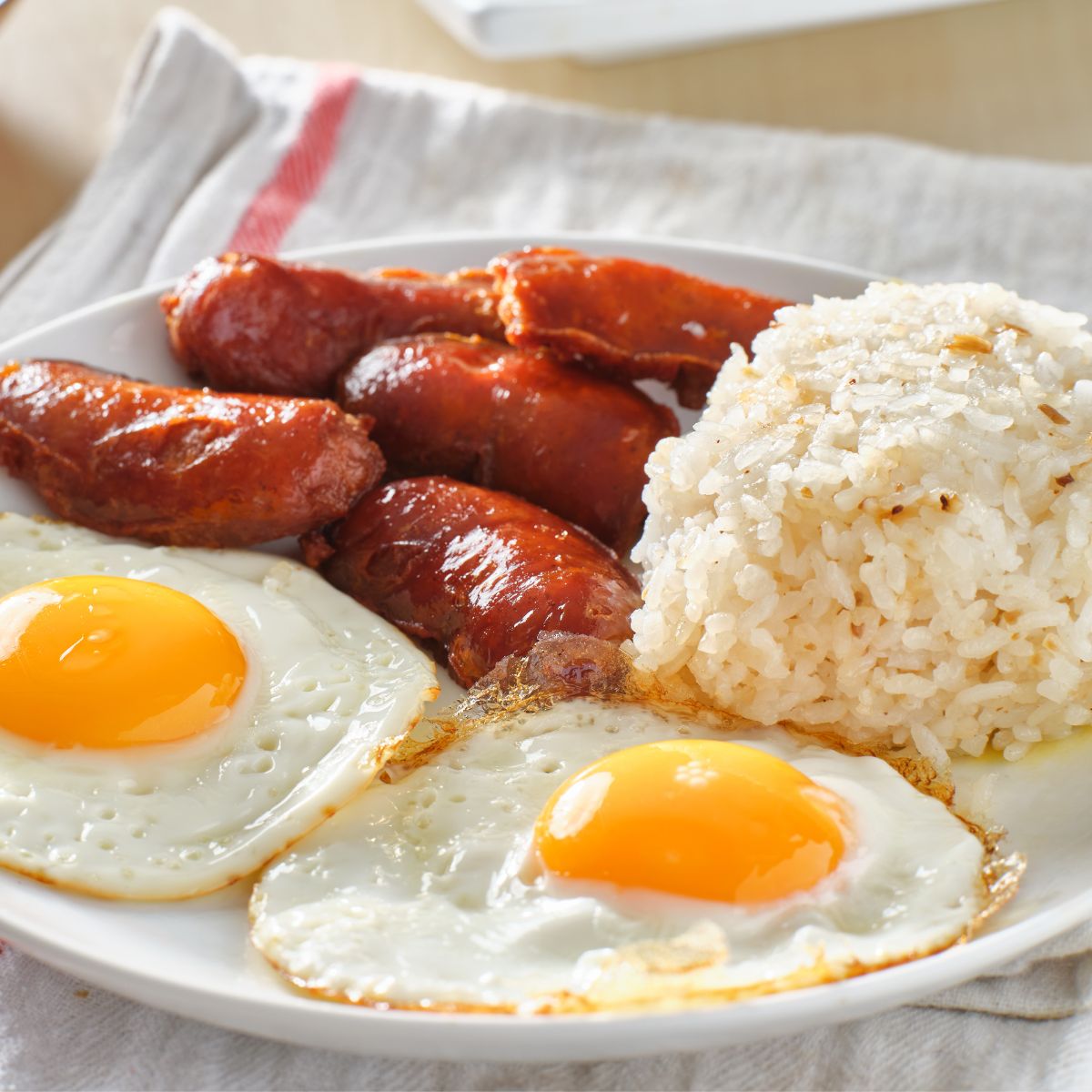 Breakfast rice with eggs and sausage.