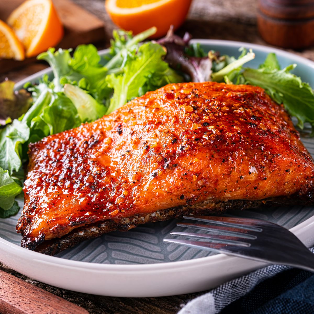 Honey-glazed salmon with a side of salad