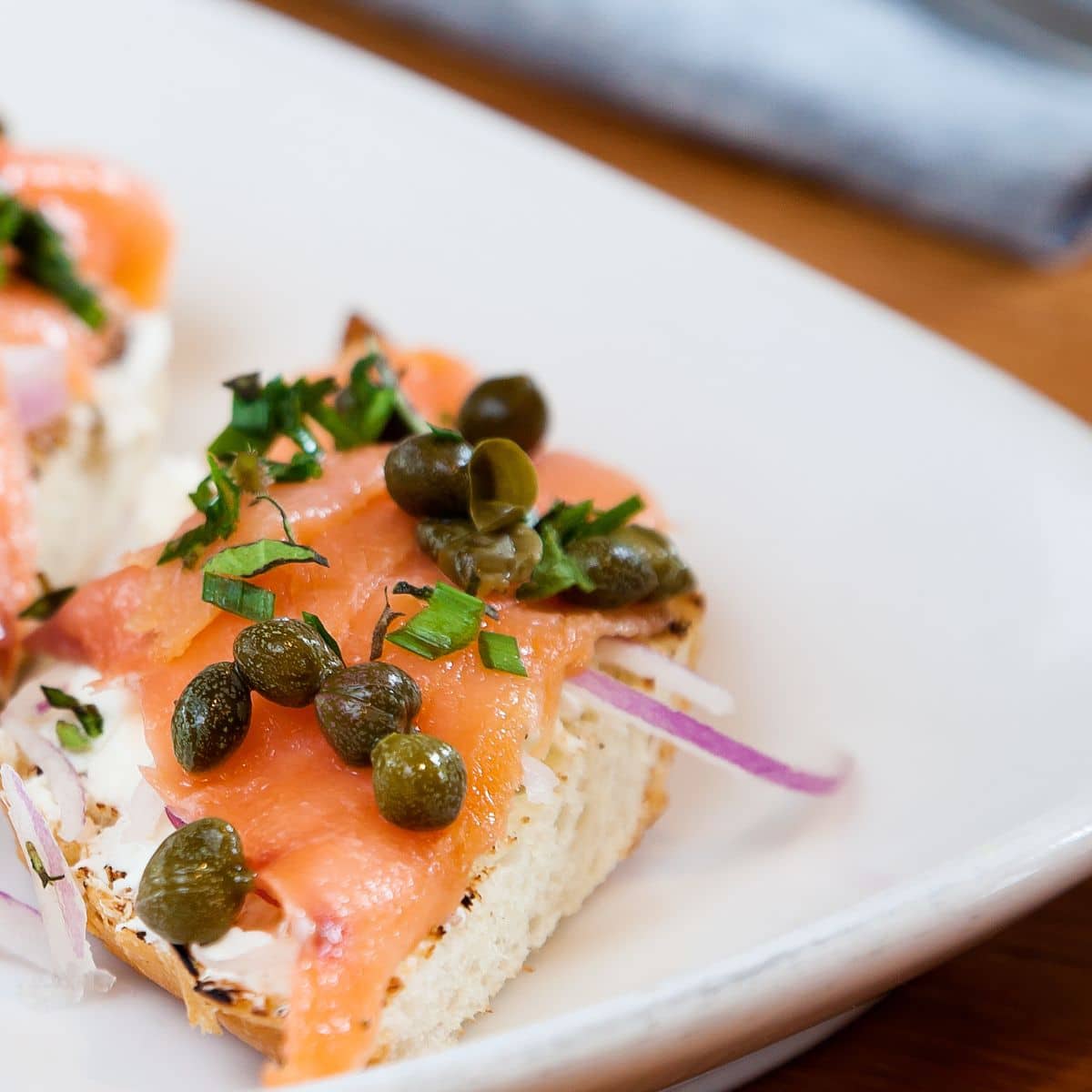 Mini appetizer with salmon and capers.