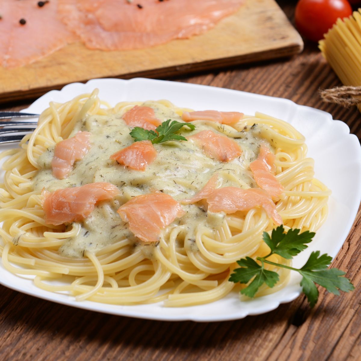 A plate of salmon and pasta.