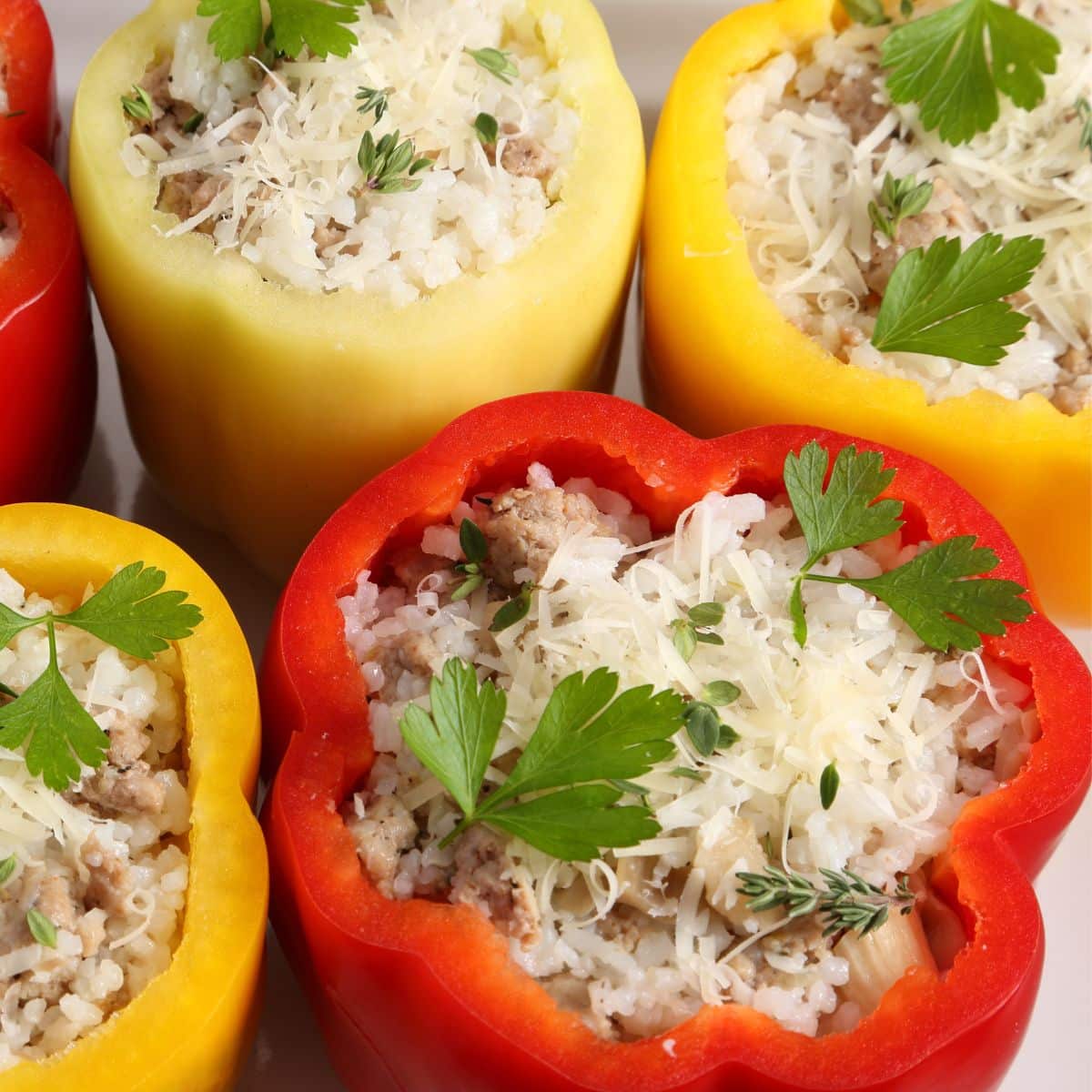 Red and yellow stuffed bell peppers.