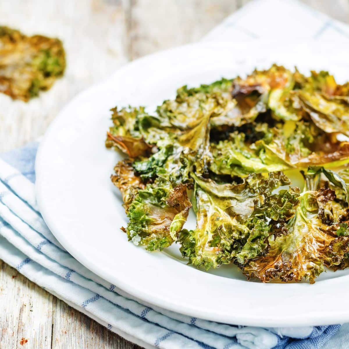 Kale chips on a while plate. 