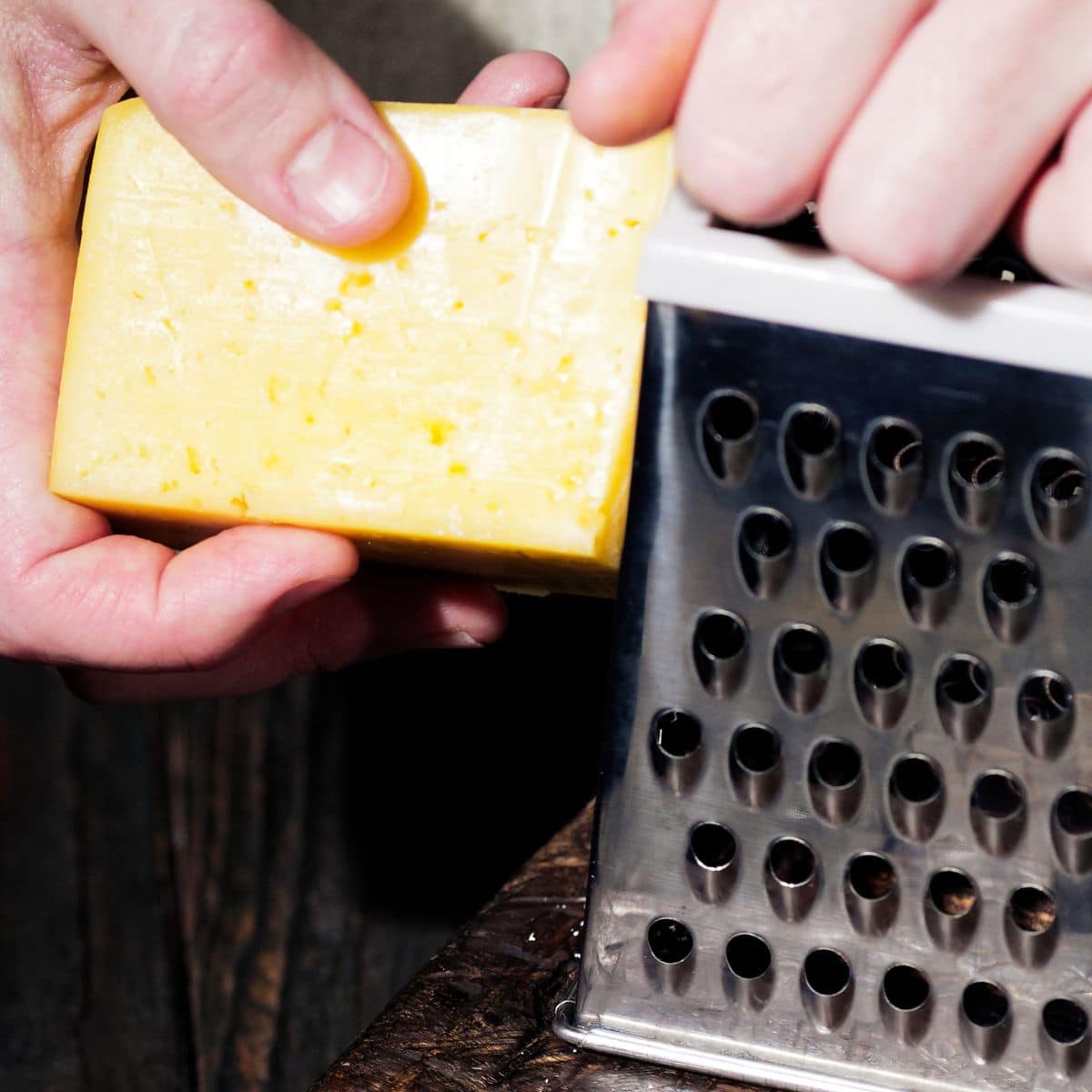 a block of cheese and a shredder.