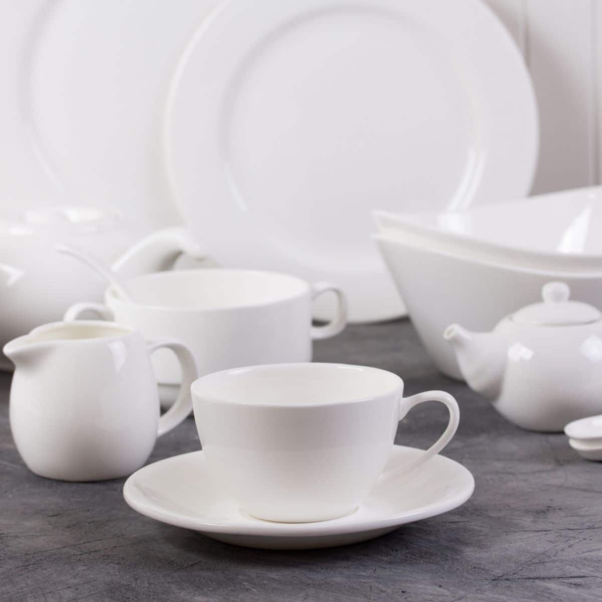 a set of white dishes.