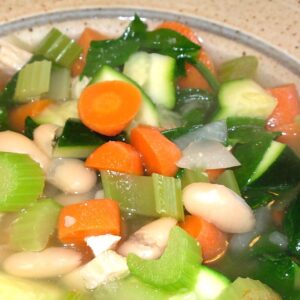 Tuscan style chicken soup with carrots, celery, spinach and cannelini beans.