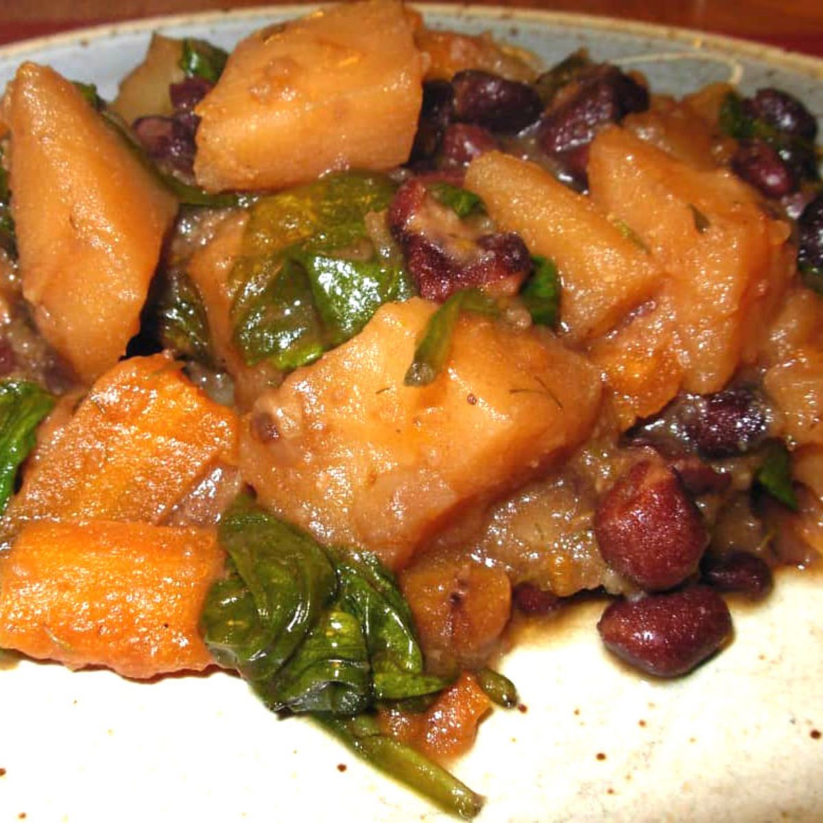 Veggie stew with potatoes, carrots, spinach and beans. 