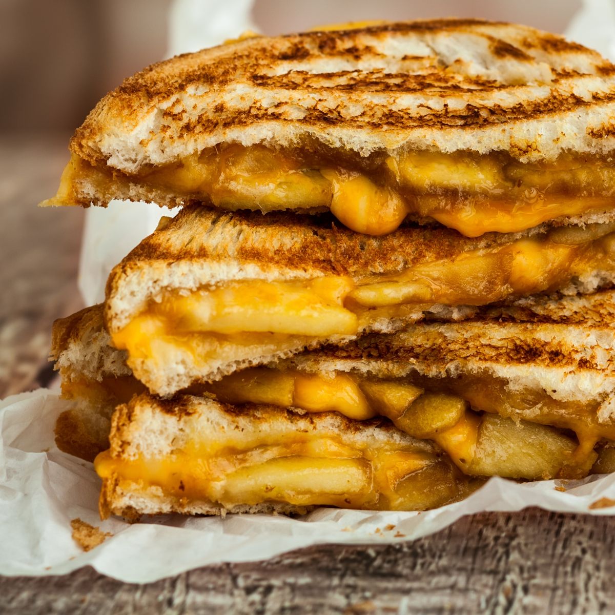 A pile of grilled cheese sandwiches. 