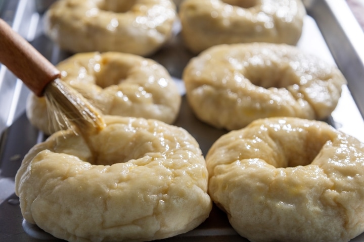 brush bagels with egg wash mixture and cover with sesame or poppy seeds