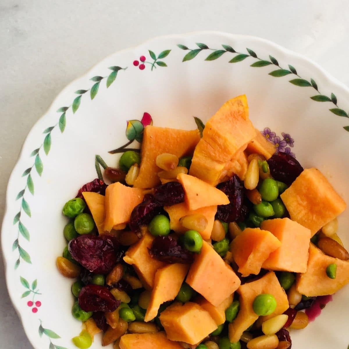 Sweet potato salad with peas and pine nuts.