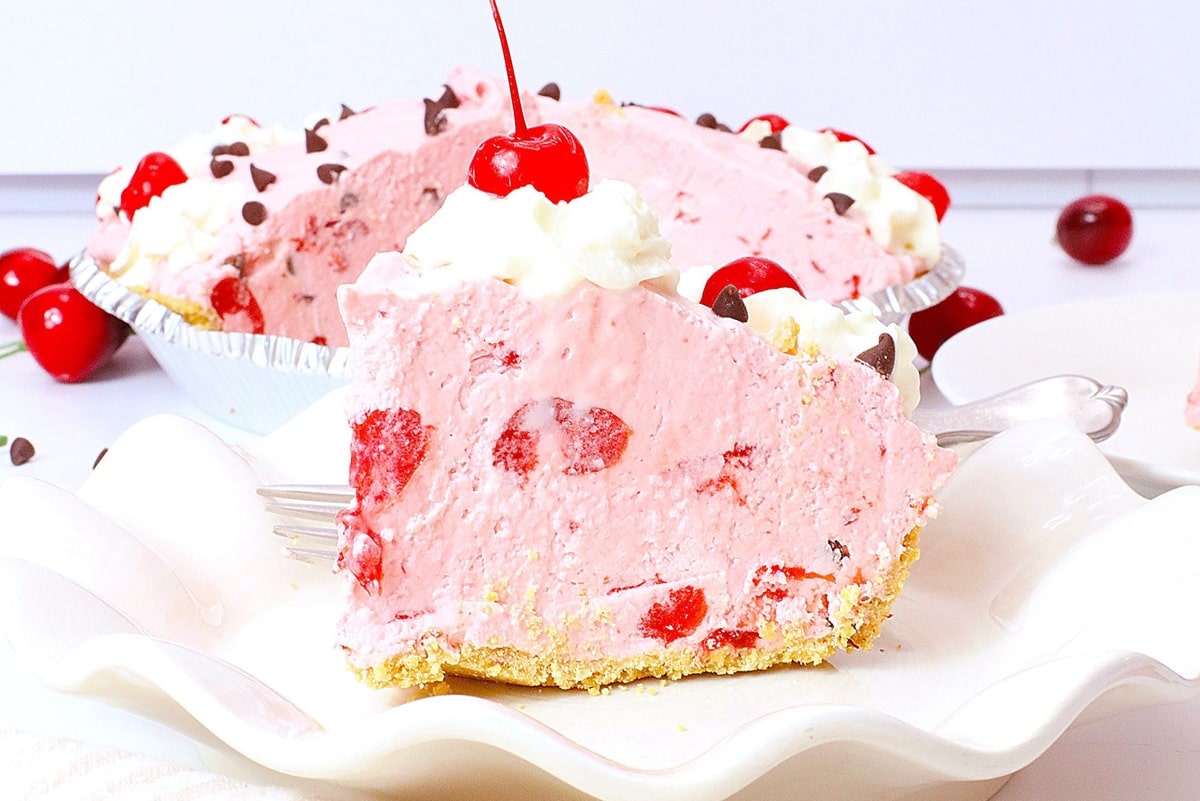 fluffy and light cherry pie with whipped cream and cream cheese