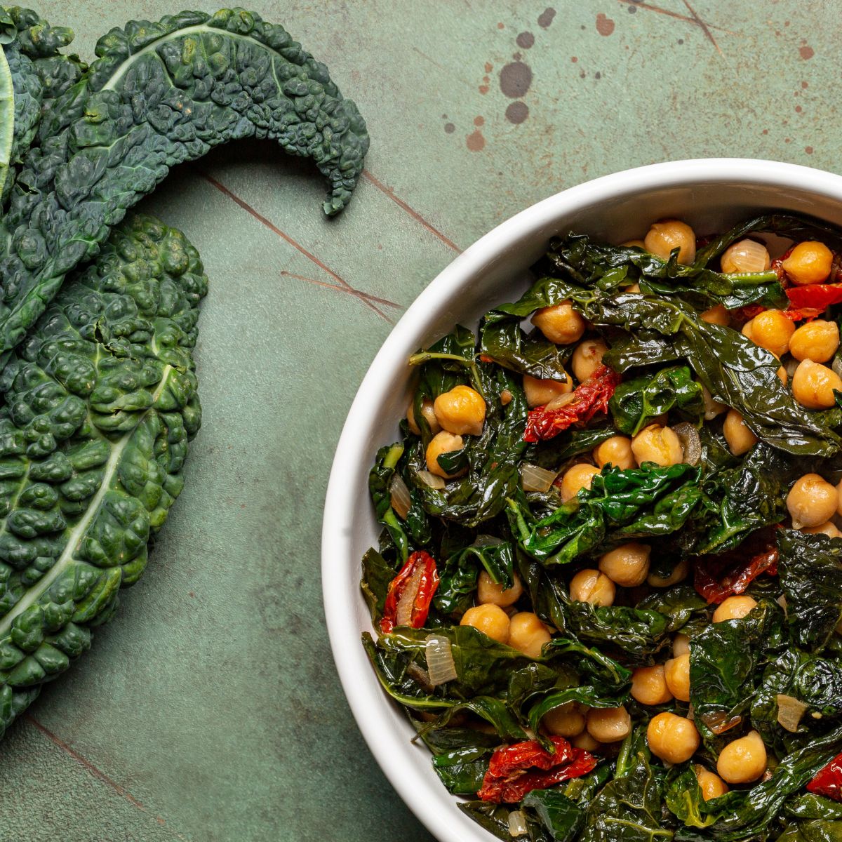 Colorful sauteed kale with chickpeas and sun-dried-tomatoes.