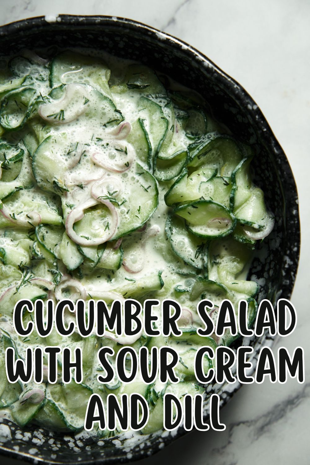 Cucumber salad with sour cream and dill.