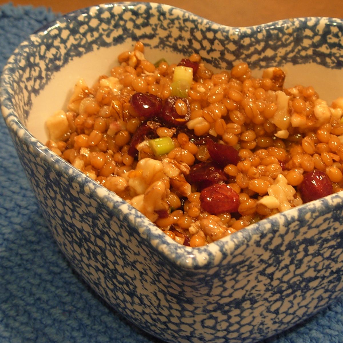 Wheat berry salad in a heart shaped bowl. 