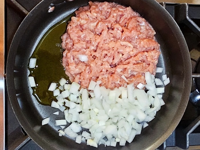 saute onions and ground chicken