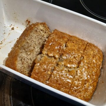 Moist sweet banana bread with powdered sugar glaze