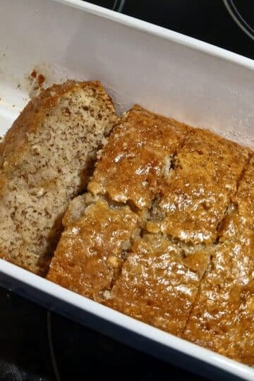 Moist sweet banana bread with powdered sugar glaze