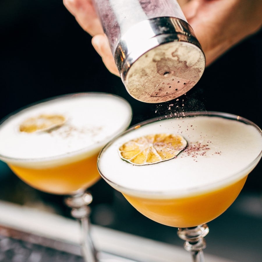 bartender making orange drink