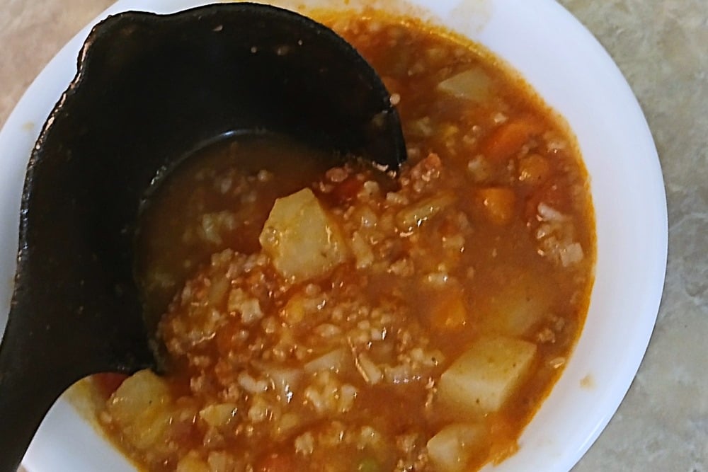 bowl of homemade vegetable soup with hamburger meat