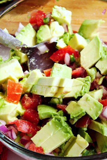 mixing chunky guacamole