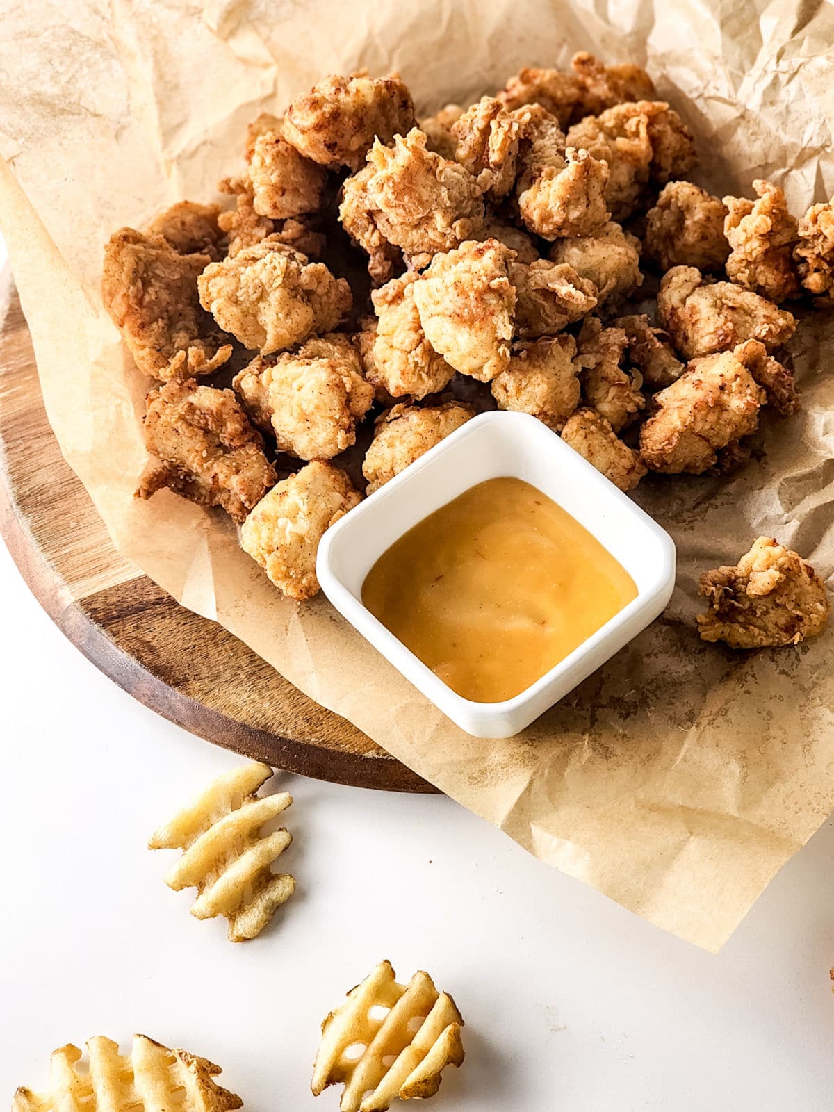 Copycat Chick Fil A Nuggets served with waffle fries