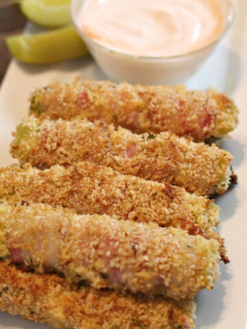 bacon wrapped fried pickles horizontal image with ranch
