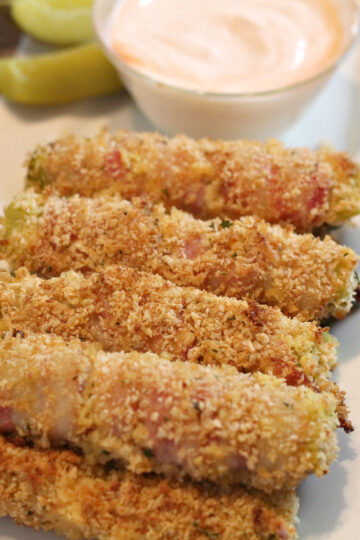 bacon wrapped fried pickles horizontal image with ranch