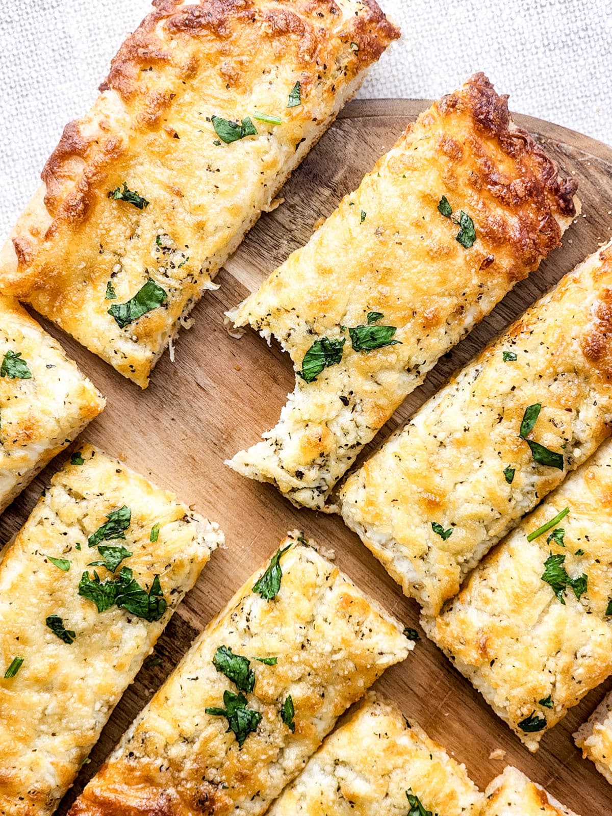 pizza dough cheese breadsticks with bite taken out of one