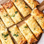 cut cheese sticks on board