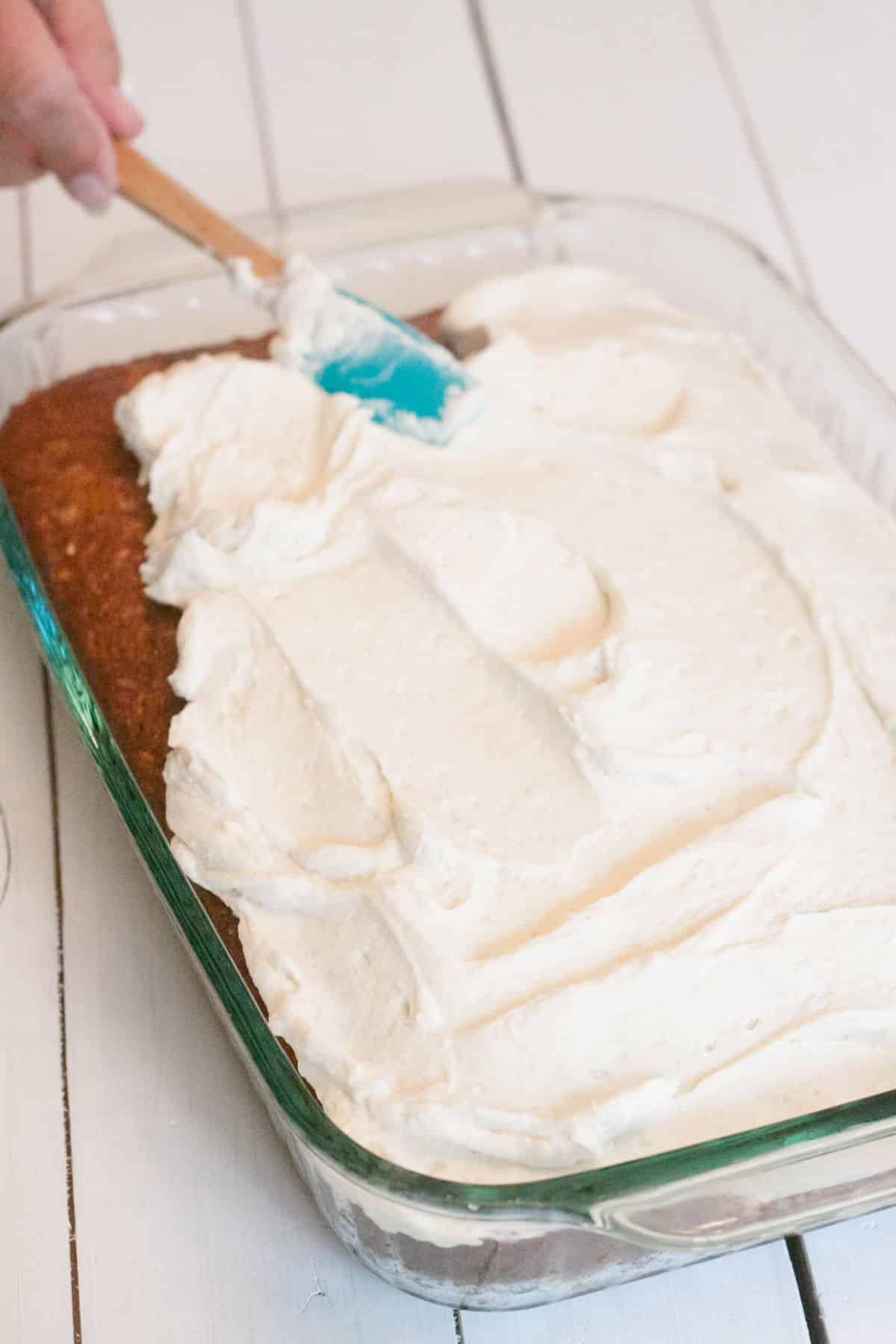 spreading cream cheese frosting