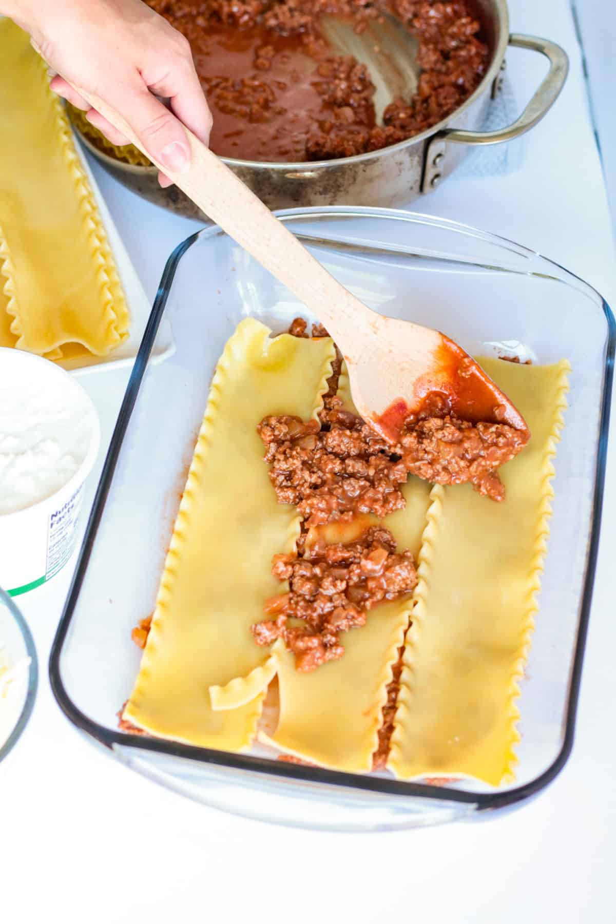 adding meat to lasagna 