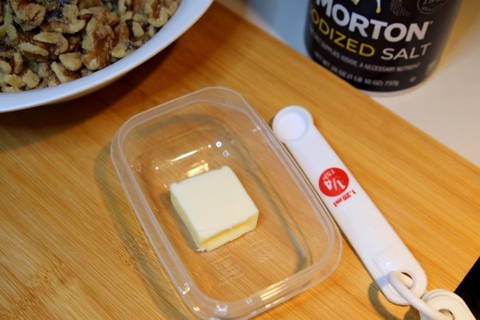 coat raw walnuts with a bit of butter for toasting