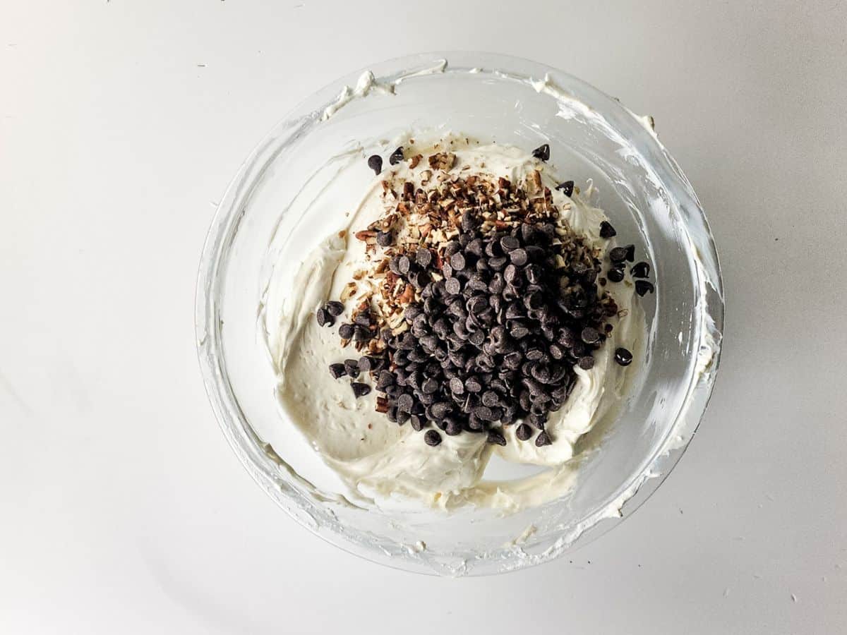 adding chocolate chip to cheesecake mix
