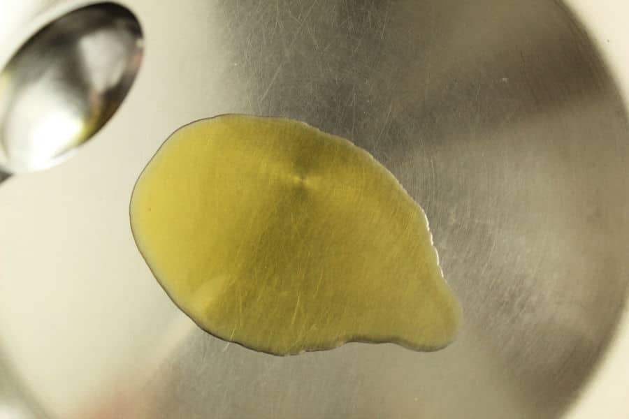 heating olive oil to cook shrimp