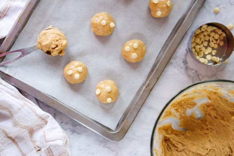 mixing dough into balls for cookies