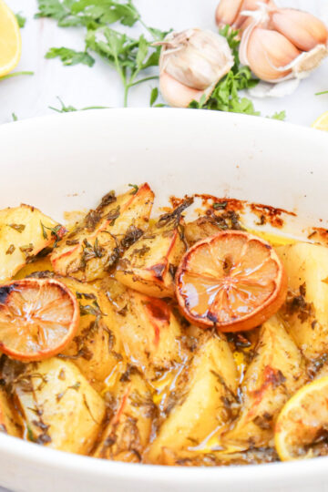 Lemon Greek Potatoes in white dish