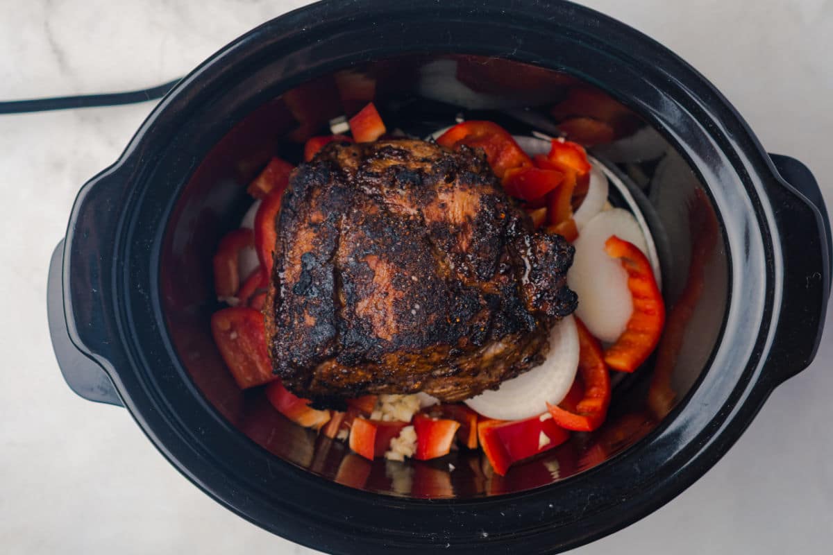 add pork to slow cooker with veggies