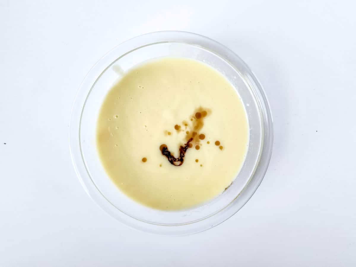 adding vanilla to whisked milk