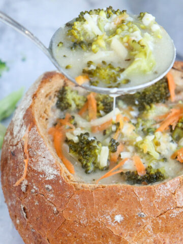 top view of Broccoli Cheddar Cheese Soup in bread bowl