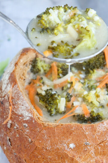 top view of Broccoli Cheddar Cheese Soup in bread bowl