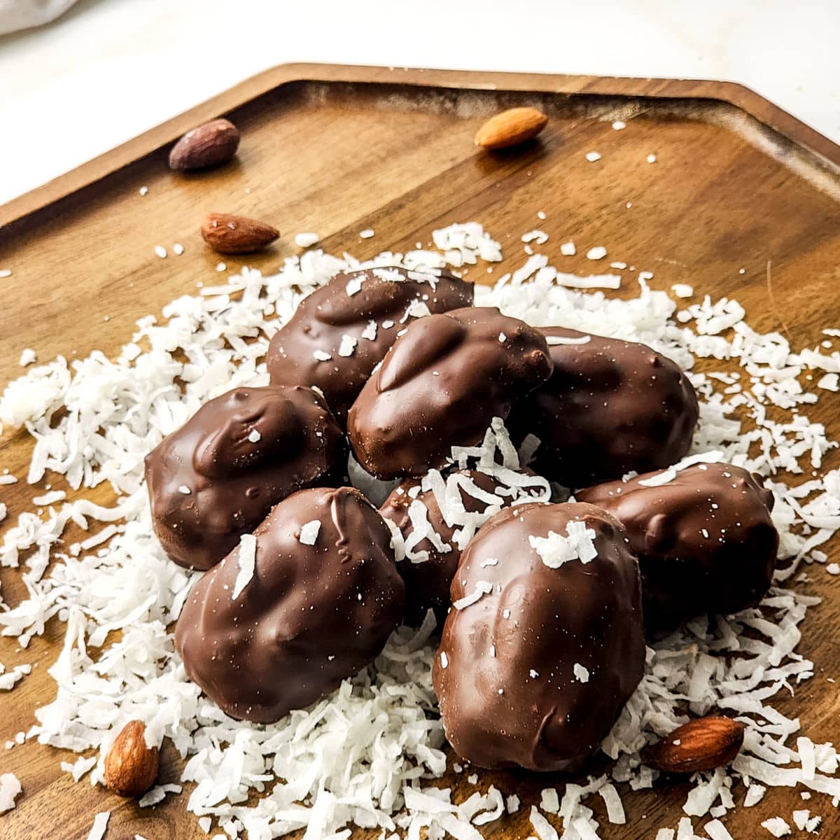 top view of homemade almond joy bites on wood board