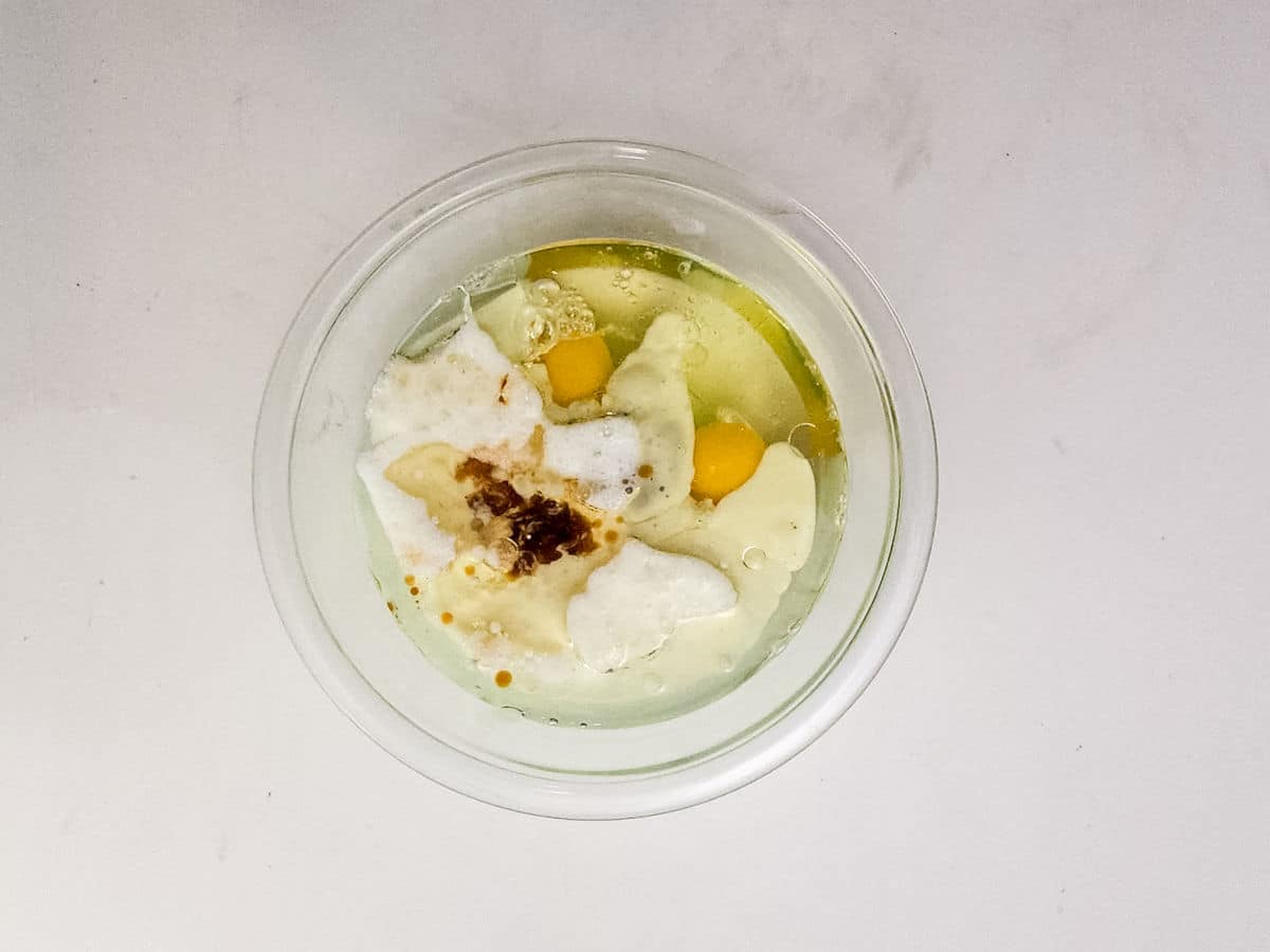 whisking together sugar, flour, cocoa powder, espresso powder, baking soda, baking powder, and salt.