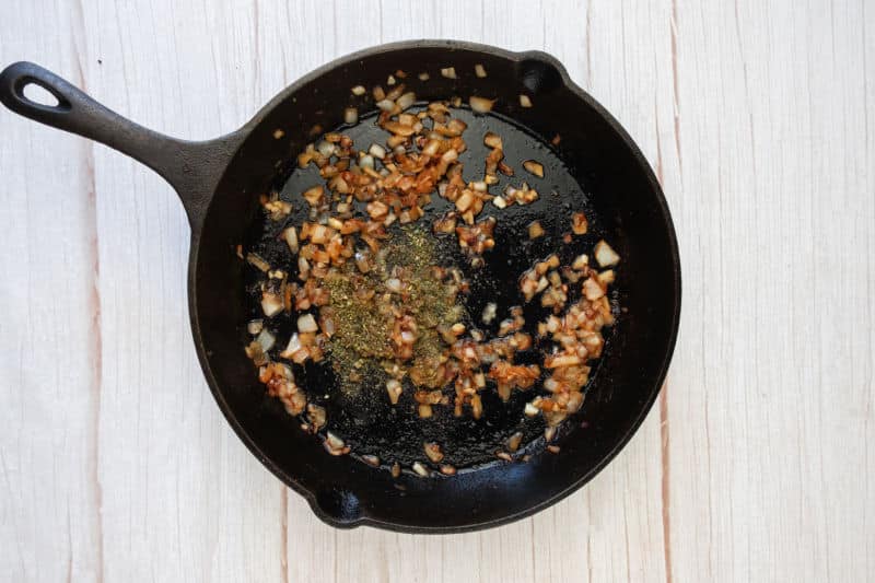 heating olive oil in large skillet