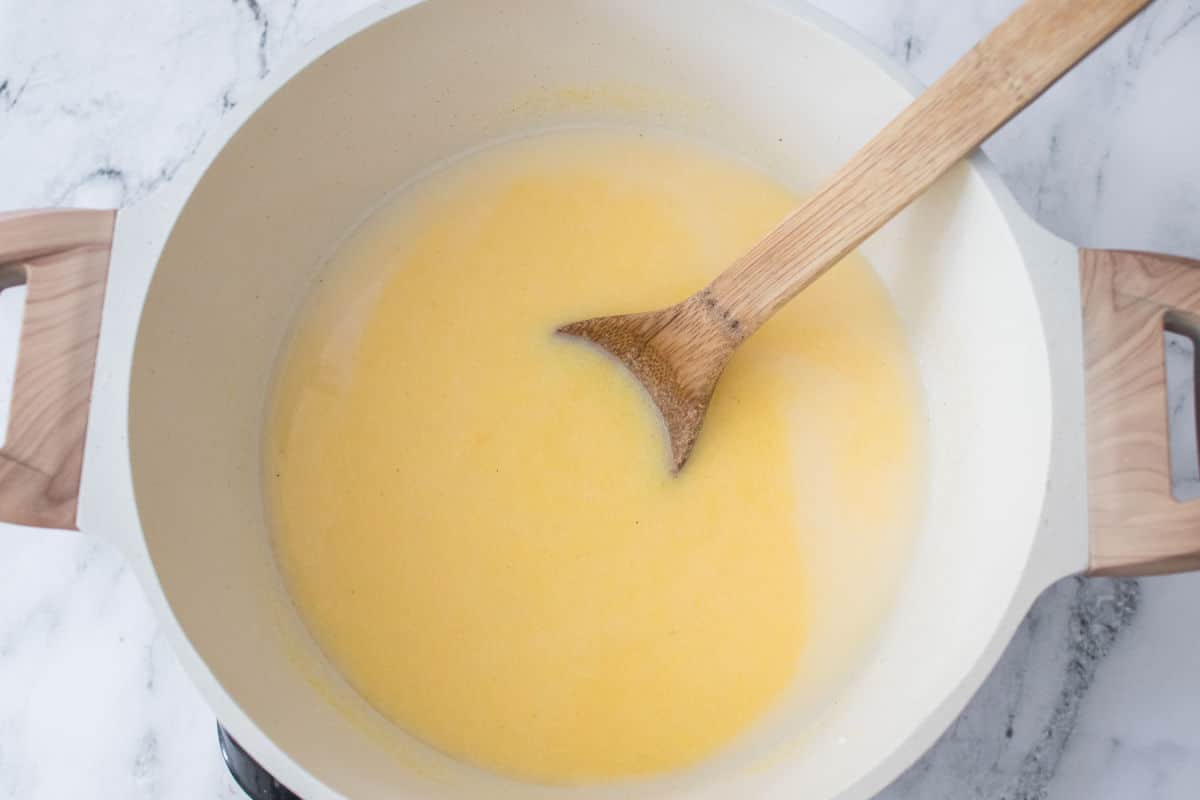mixing cornmeal in boiled water and milk