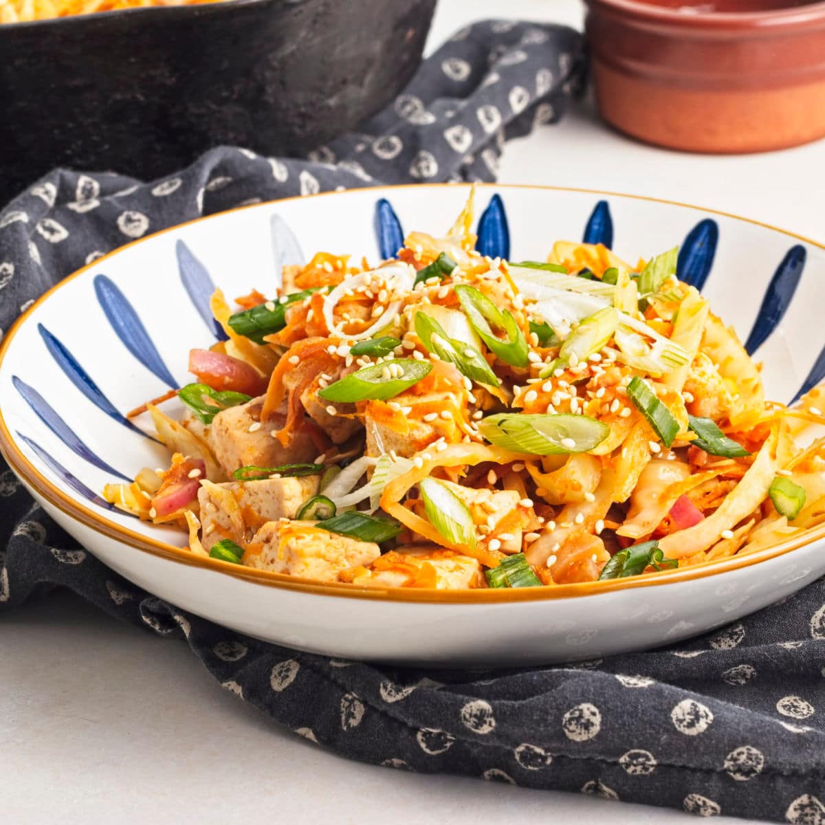 vegan egg roll bowl in blue and white dish