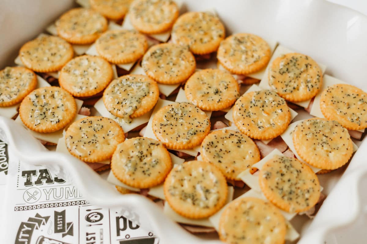 brushing top of crackers with melted butter and spice mixture