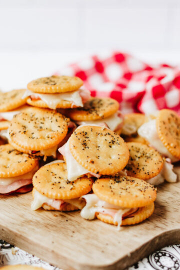 Ham and Swiss Ritz Party Sandwiches on cutting board