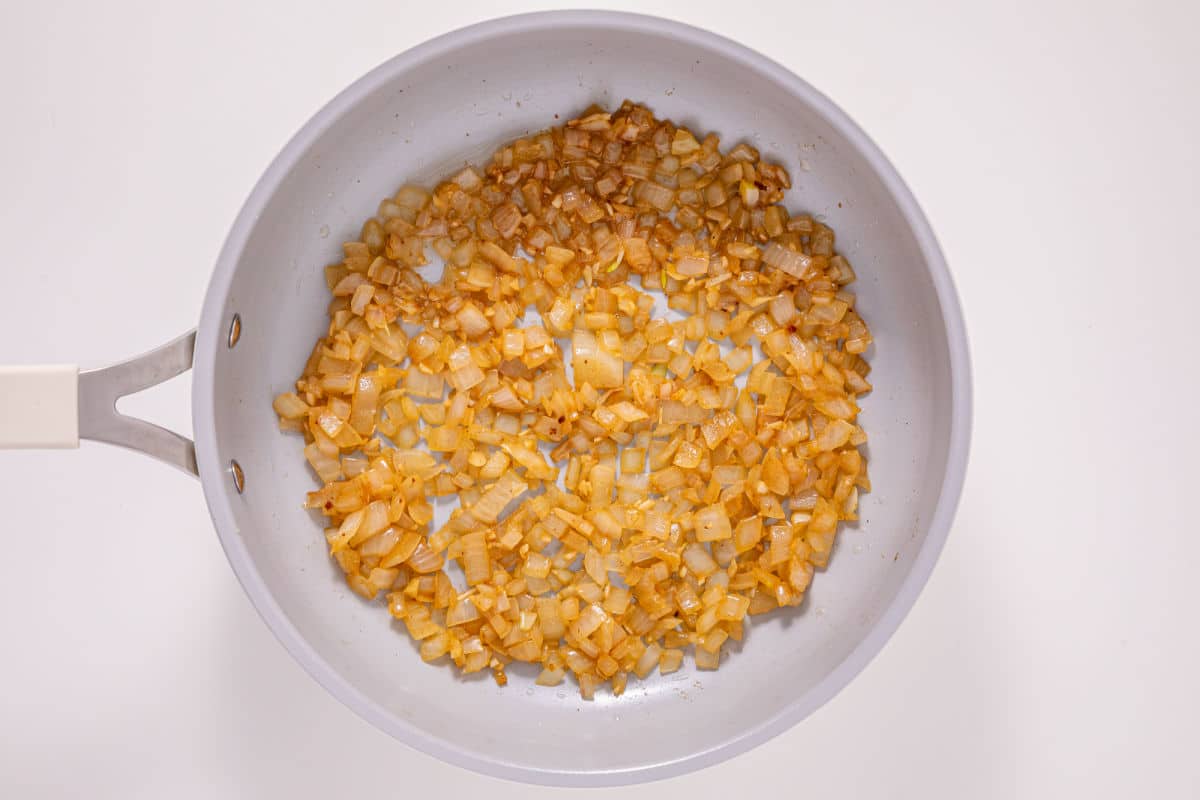 sauteing onions and garlic until the onions become translucent.