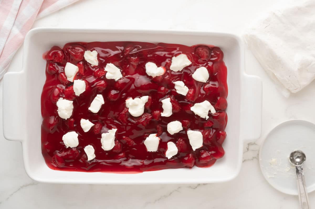 cream cheese cut into small cubes on top of the strawberry filling
