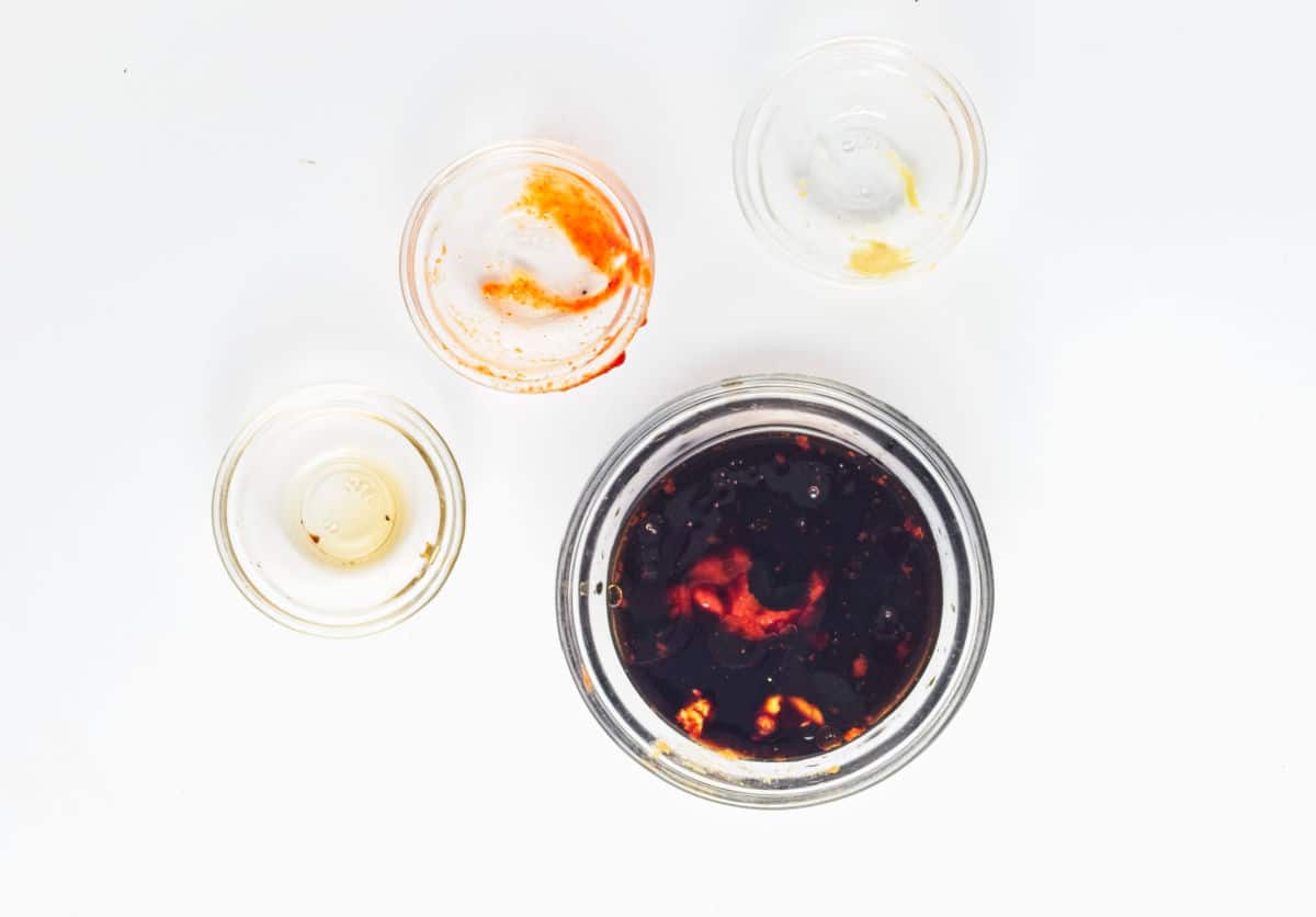 combining soy sauce, sesame oil, sriracha, and mustard.