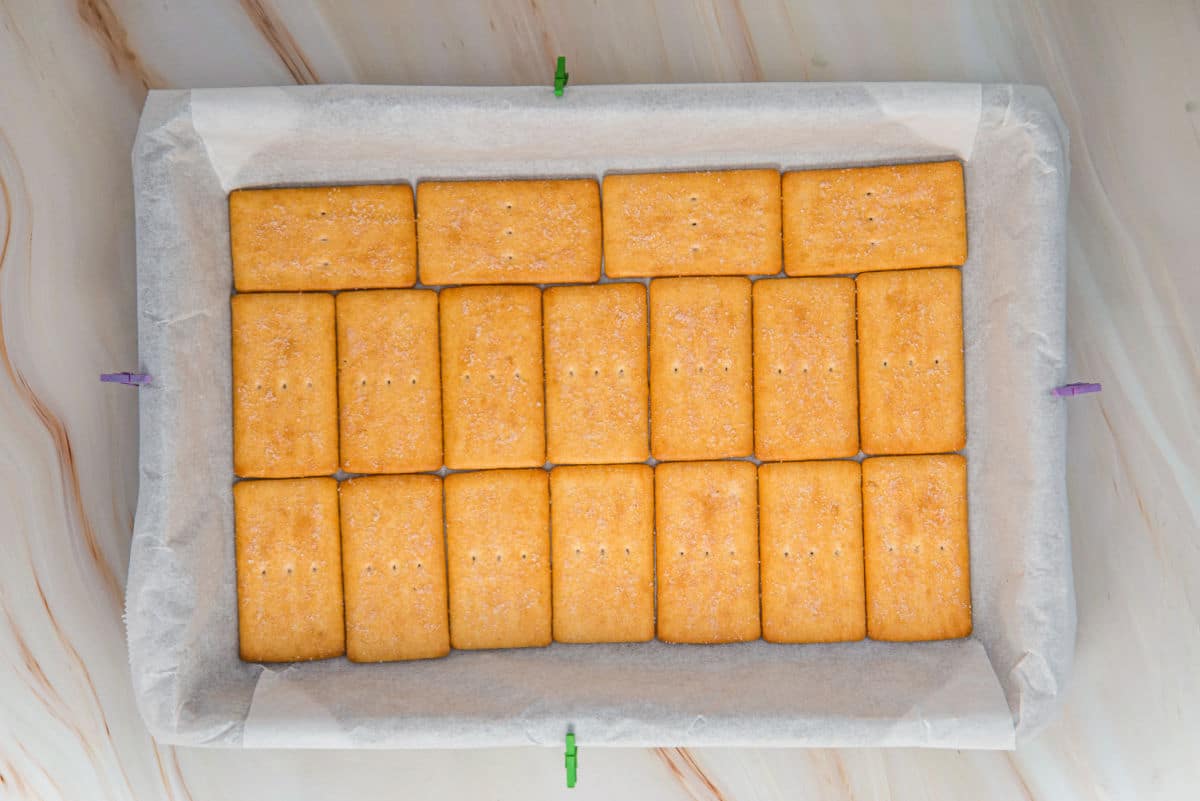 parchment paper in 9x13 pan with cookies
